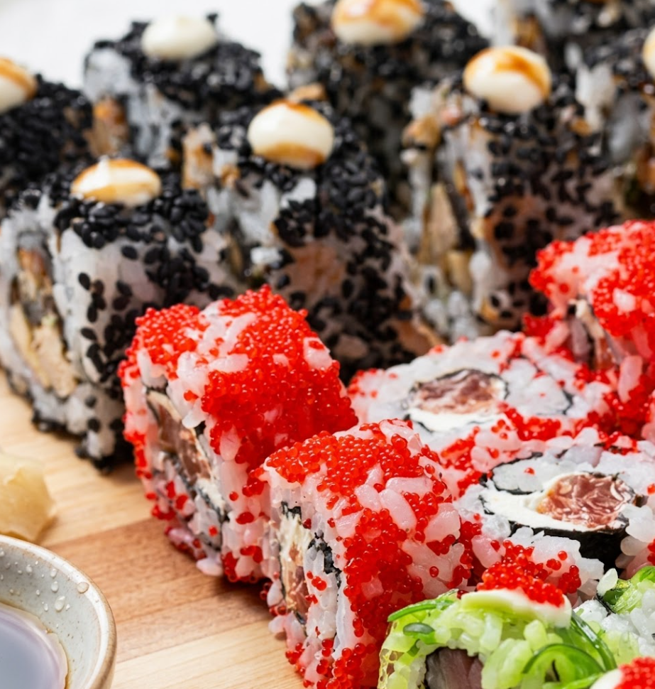 Diners enjoying sushi at Duo